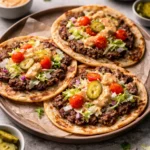 Smash Burger Tacos with special sauce served on a plate